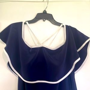 Woman’s long navy and white dress